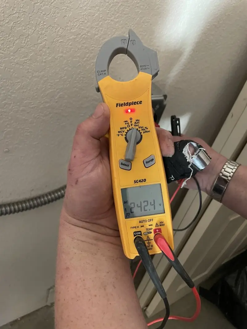 Voltage testing with clamp meter during Recessed Lighting Installation in Jarrell